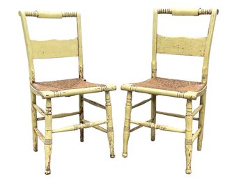 A Pair Of Antique Painted Hitchcock Style Rush Seated Side Chairs