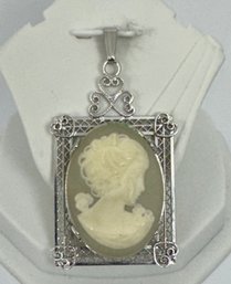 VINTAGE STERLING SILVER MOLDED CAMEO IN FILIGREE FRAME PENDANT