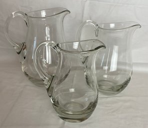 Three Blown Glass Pitchers