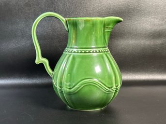 A Green Ceramic Pitcher By Baum Bros.