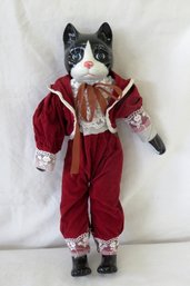 A Porcelain Ceramic Cat Doll In A Velvet Tuxedo