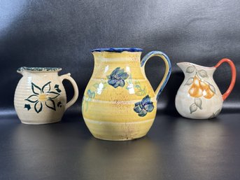 A Trio Of Compatible Ceramic Pitchers