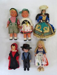 A Grouping Of Smaller Size Dolls