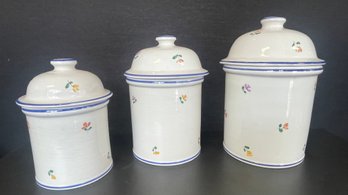 A Set Of Three Ceramic Kitchen Storage Canisters With Lids