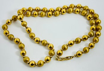 LONG SIGNED NAPIER SHINEY AND BRUSHED GOLD TONE BEAD NECKLACE