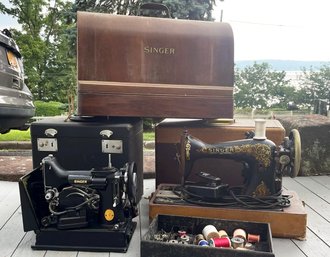 An Antique Singer Sewing Machine In Case