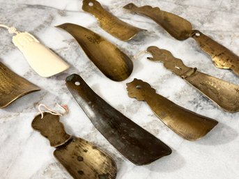 A Collection Of Vintage And Antique Brass And Bone Shoe Horns