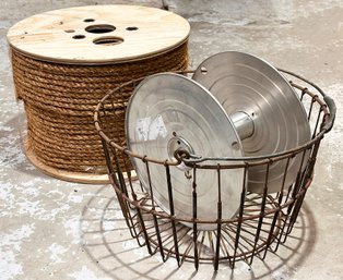 A Spool Of Rope, An Aluminum Spool, And A Vintage Metal Ball Basket