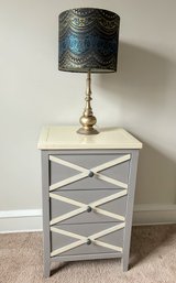 Three Drawer Side Table And Decorative Lamp