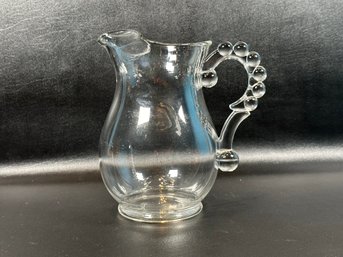 A Great Pitcher In Clear Glass With A Beaded Handle & Ice Lip