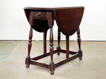 An Antique Oak Drop Leaf Side Table