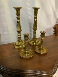 Two Pairs Of Brass Candlesticks