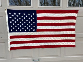 Flag Of The United States. Brass Grommets. Stitched Bars. Measures 31' X 55 1/2'.