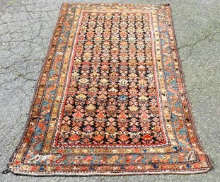 A Hand Knotted And Dyed Indo-Persian Wool Rug