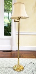 A Vintage Brass Standing Lamp With Articulating Arm