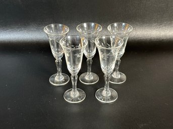 A Set Of Vintage Cordials In Etched Glass