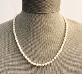 An Authentic Pearl Necklace With 14K Gold Clasp