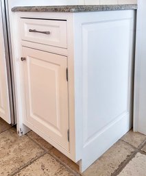 A Lower Painted Wood Cabinet With Granite Top