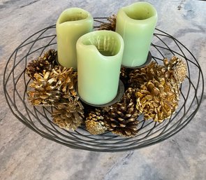 Black Wrought Iron Woven Metal Candle Holder With Candles And Golden Pine Cones