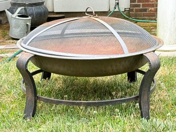 An Outdoor Firepit With Mesh Lid