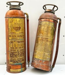 A Pairing Of Vintage Copper Fire Extinguishers