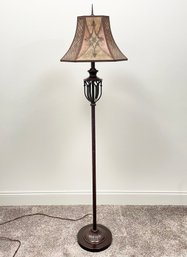 A Vintage Bronze Standing Lamp With Ornate Shade