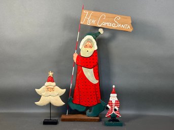 A Selection Of Decorative Wooden Santas