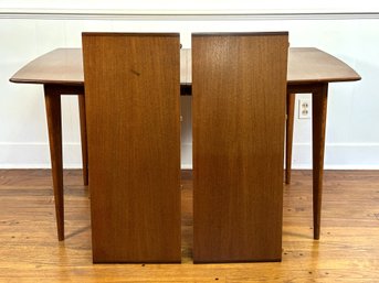 A Mid-Century Modern Teak Dining Table, Two Leaves