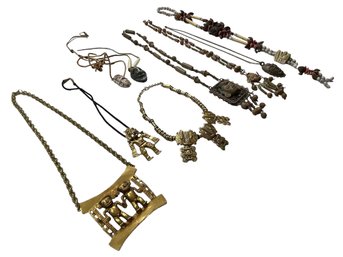 Amazing Collection Of Necklaces From World Travels Featuring Faces & Figures Of Many Lands