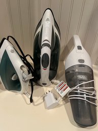 A Collection Of Irons And Cordless Power Vacuum