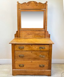 A Mid-19th Century Carved And Paneled Oak Dresser With Mirror