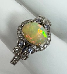 SIGNED STS STERLING SILVER YELLOW OPAL AND WHITE STONE RING