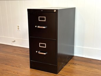 A Two-Drawer Black Metal Filing Cabinet By HON