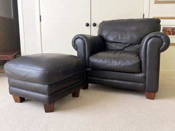 A Natuzzi Leather Armchair And Ottoman