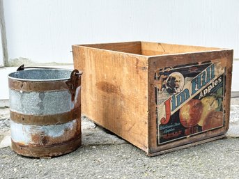 An Industrial Crate And A Galvanized Bucket