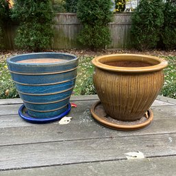 A Pair Of Ceramic Glazed Planters