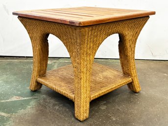 A Teak And Wicker Side Table