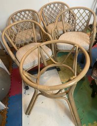 Set Of Four Rattan Chairs On Wheels And Table