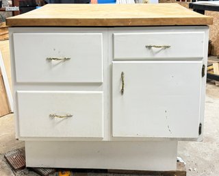 A Kitchen Island With Maple Butcher Block And Custom Cabinetry