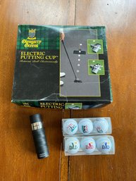 An Electric Putting Golf Cup & Golf Balls