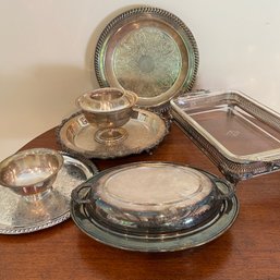 A Collection Of Silverplate Entertaining Pieces