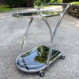 A Glamorous Art Deco Chrome And Smoked Glass Bar Cart