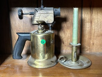 ACETYLENE TORCH AND AN ANTIQUE CANDLESTICK