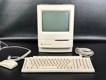 A Vintage 1990s Apple Computer, The Macintosh Classic, With Keyboard, Mouse & Cables