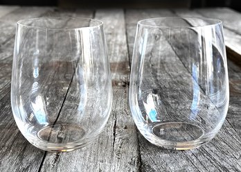 A Pair Of Riedel Crystal Stemless Wine Glasses