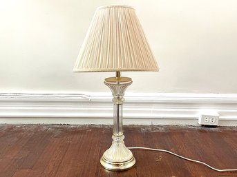 A Glass And Brass Lamp