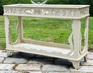 An Antique Scrollwork Plant Stand With Distressed Painted Finish