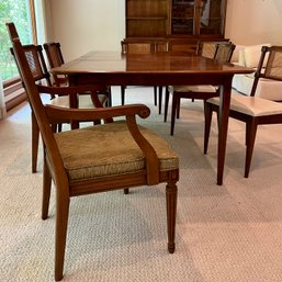 An MCM Dining Room Table With Henredon Chairs