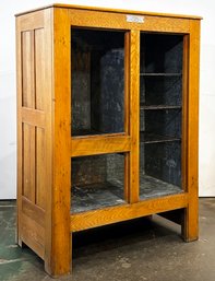 An Antique Oak Ice Box Repurposed As Shelf Unit