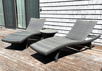 A Pair Of Modern Woven Lounge Chairs And A Cocktail Table By Frontgate